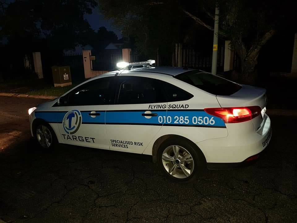 Target Flying Squad response vehicle at night with roof lights on